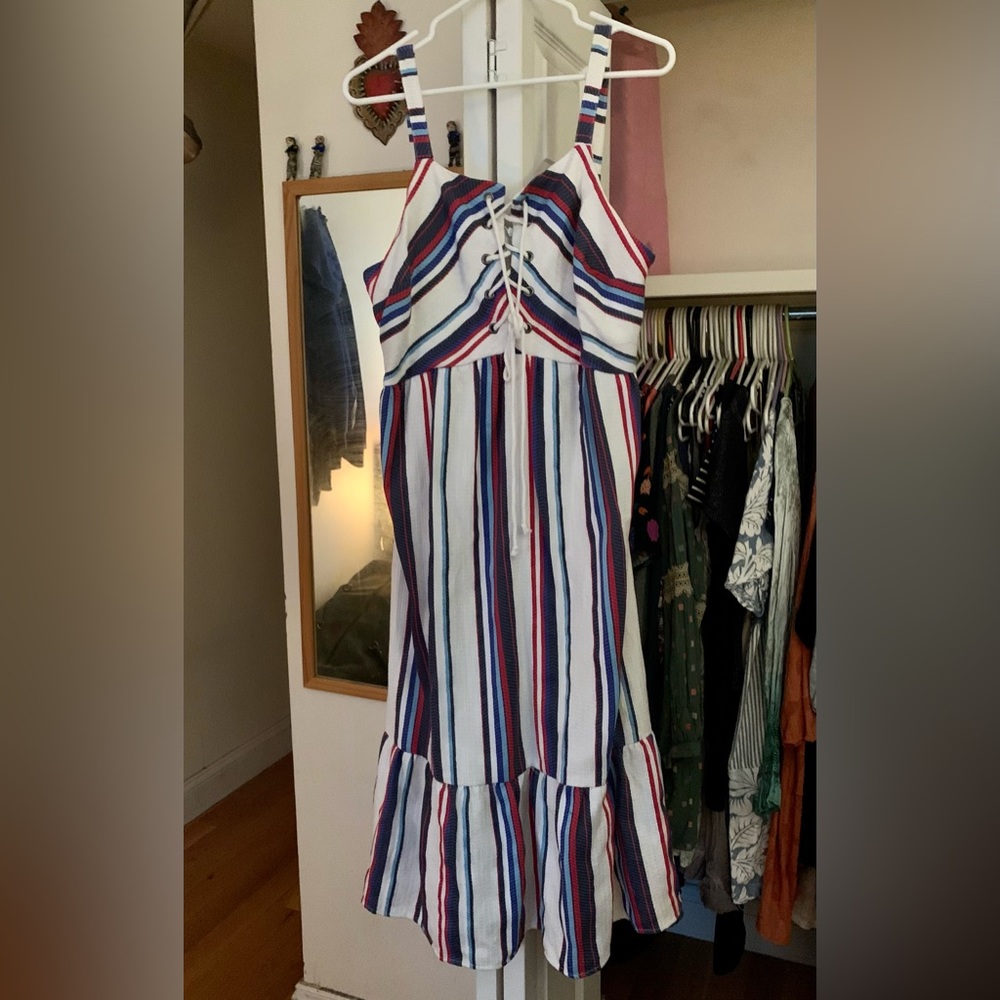 Lost and wander large never work tags on Anthropologie dress.